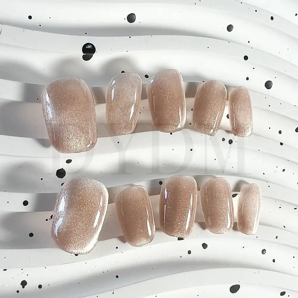 Champagne Lust Champagne Lust Mesmerizing cat eye handmade press-on nails in a luxurious champagne hue, creating an enchanting play of light and shimmering allure