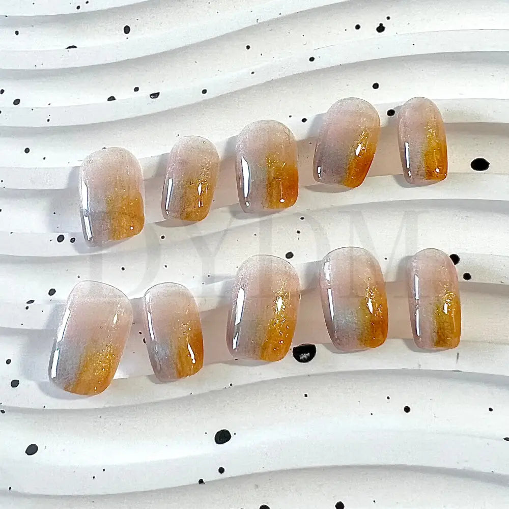 Rainbow Halo Handmade Press on nails, feature a light pink base color adorned with a captivating duo of blue and orange cat eye tips, forming a mesmerizing French tip effect.