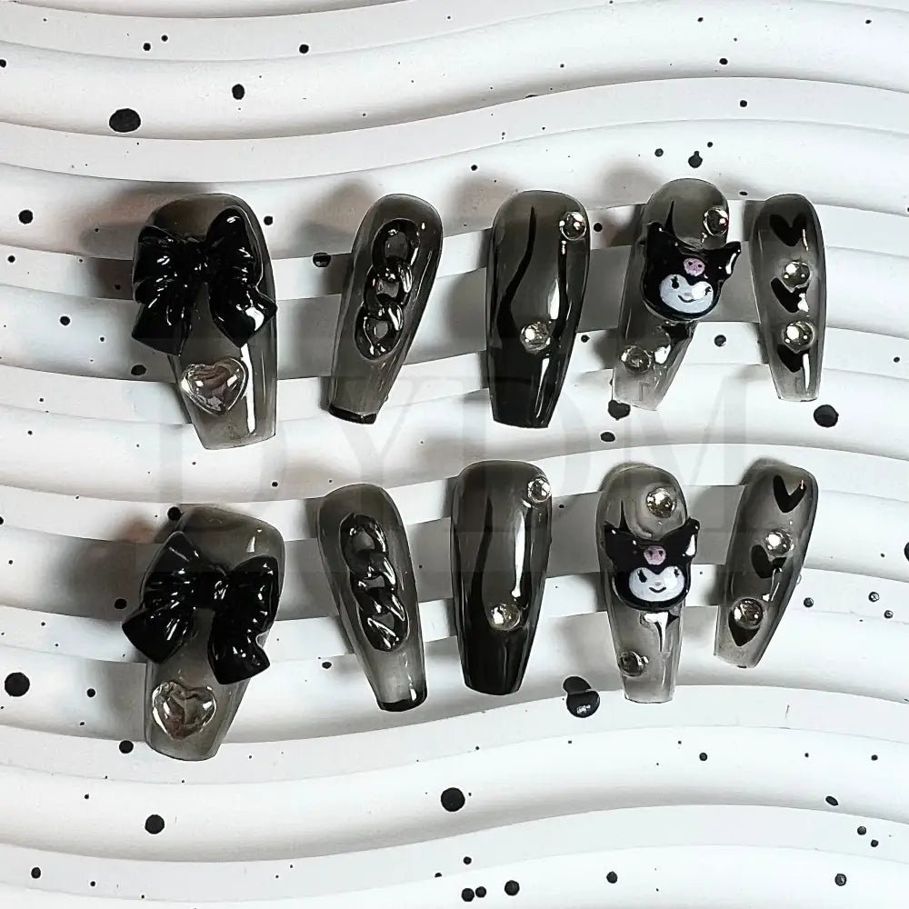 Wicked Kuromi Transparent black handmade press on nails that showcases the iconic Sanrio character, Kuromi, capturing her mischievous charm with edgy and sophisticated style 