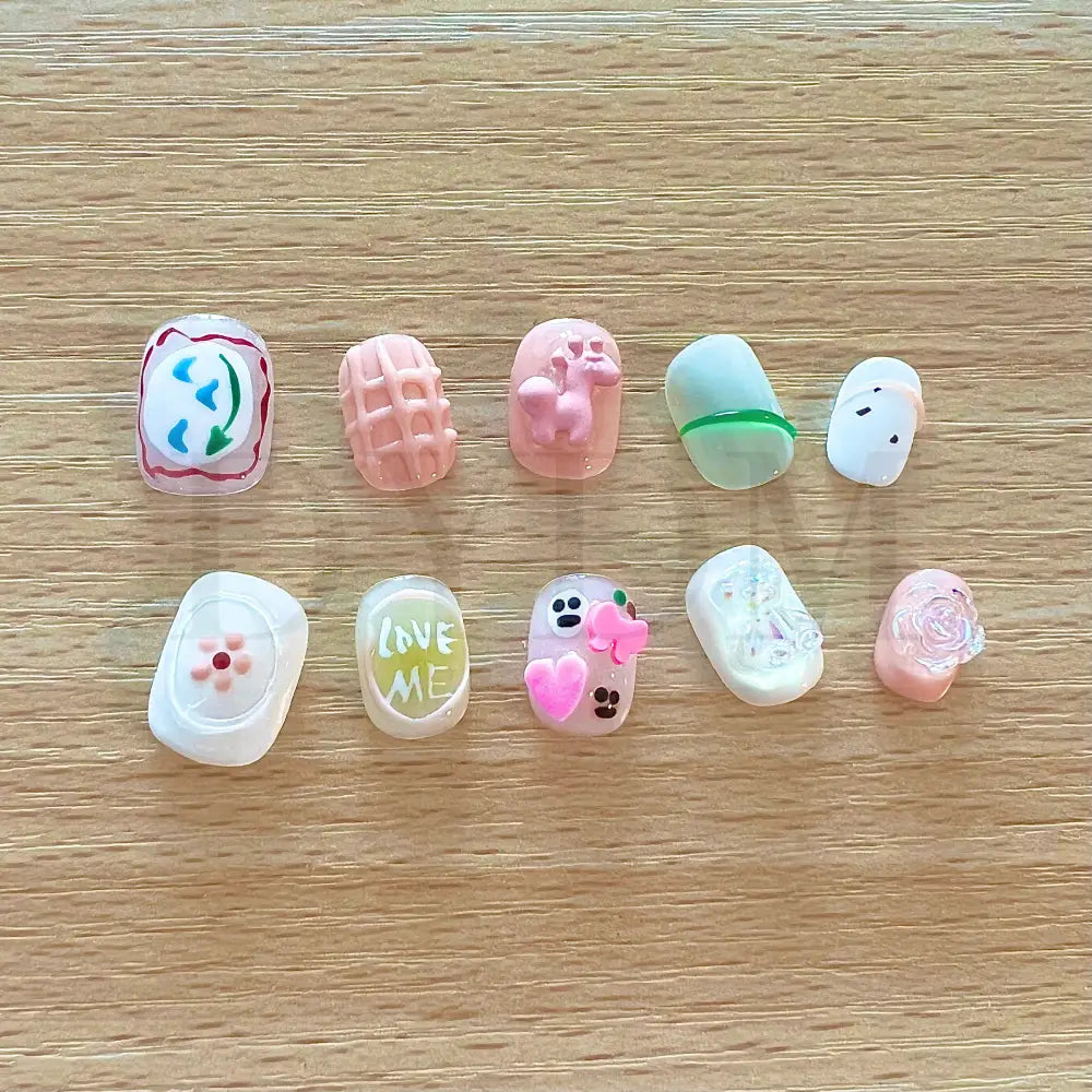 Beary Sweet Colorful and cute squoval short handmade reusable press-on nails adorned with adorable 3D charms, adding a touch of sweetness and playfulness to your fingertips.