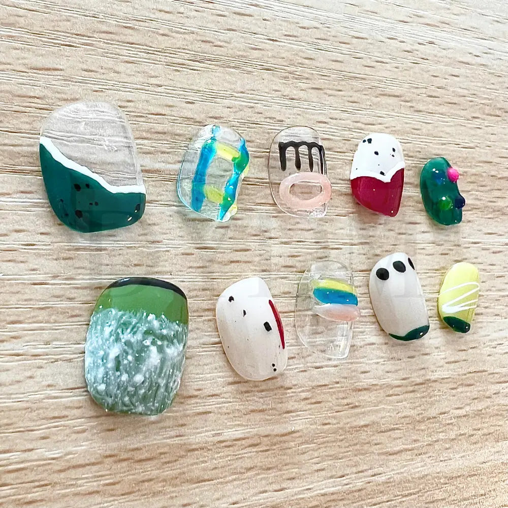 Color Crush Vibrant short, round, handmade press-on manicure with playful and unique designs in a variety of vibrant colors