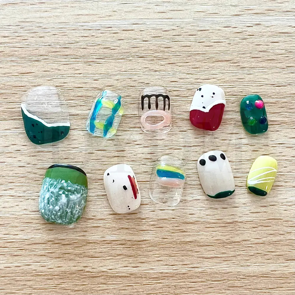 Color Crush Vibrant short, round, handmade press-on manicure with playful and unique designs in a variety of vibrant colors