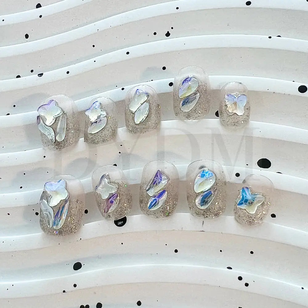 Crystal Crush Handmade reusable nails with a dazzling bling effect, featuring sparkling crystal gemstones that add a captivating shine and draw attention to your fingertips.