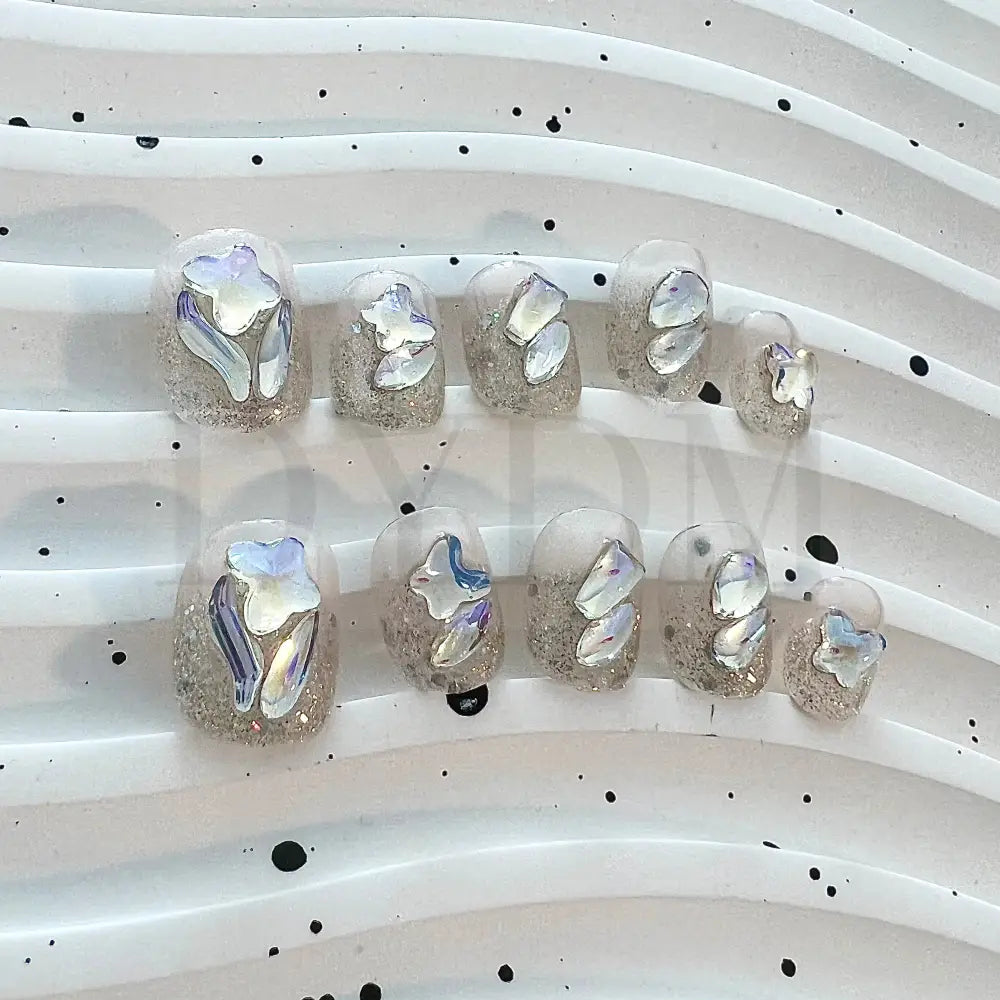 Crystal Crush Handmade reusable nails with a dazzling bling effect, featuring sparkling crystal gemstones that add a captivating shine and draw attention to your fingertips.