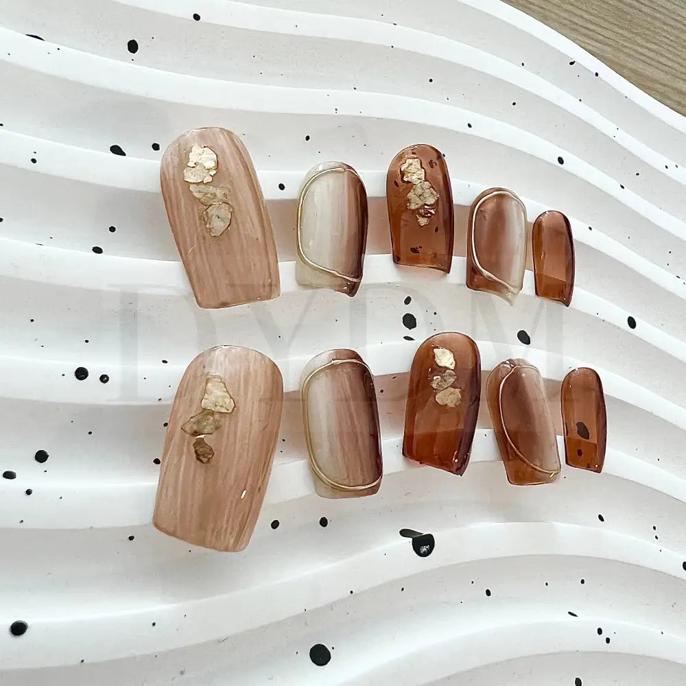 Dusk Till Dawn Stunning ombre handmade press-on nails that capture the beauty of transitioning from dusk till dawn. The golden hues and intricate gold foil accents bring a luxurious and radiant touch to your manicure