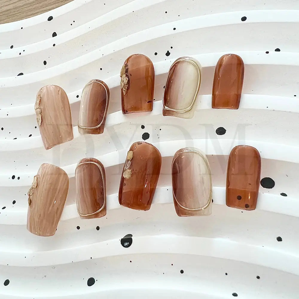 Dusk Till Dawn Stunning ombre handmade press-on nails that capture the beauty of transitioning from dusk till dawn. The golden hues and intricate gold foil accents bring a luxurious and radiant touch to your manicure