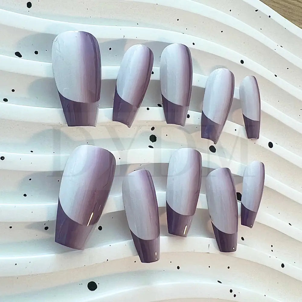 French Ombre Featuring a captivating purple gradient effect, these hand painted press-on manicure add a unique touch of style to your fingertip.