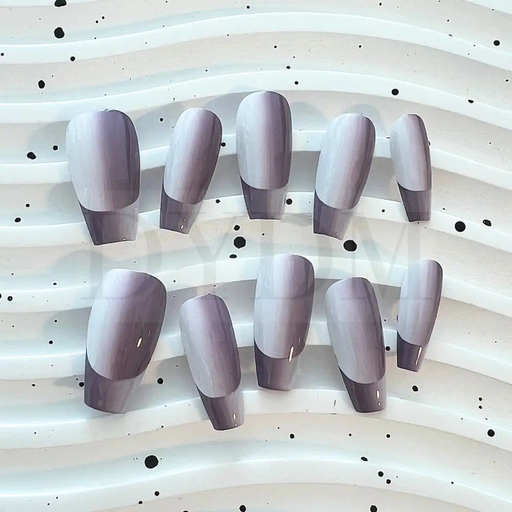 French Ombre Featuring a captivating purple gradient effect, these hand painted press-on manicure add a unique touch of style to your fingertip.