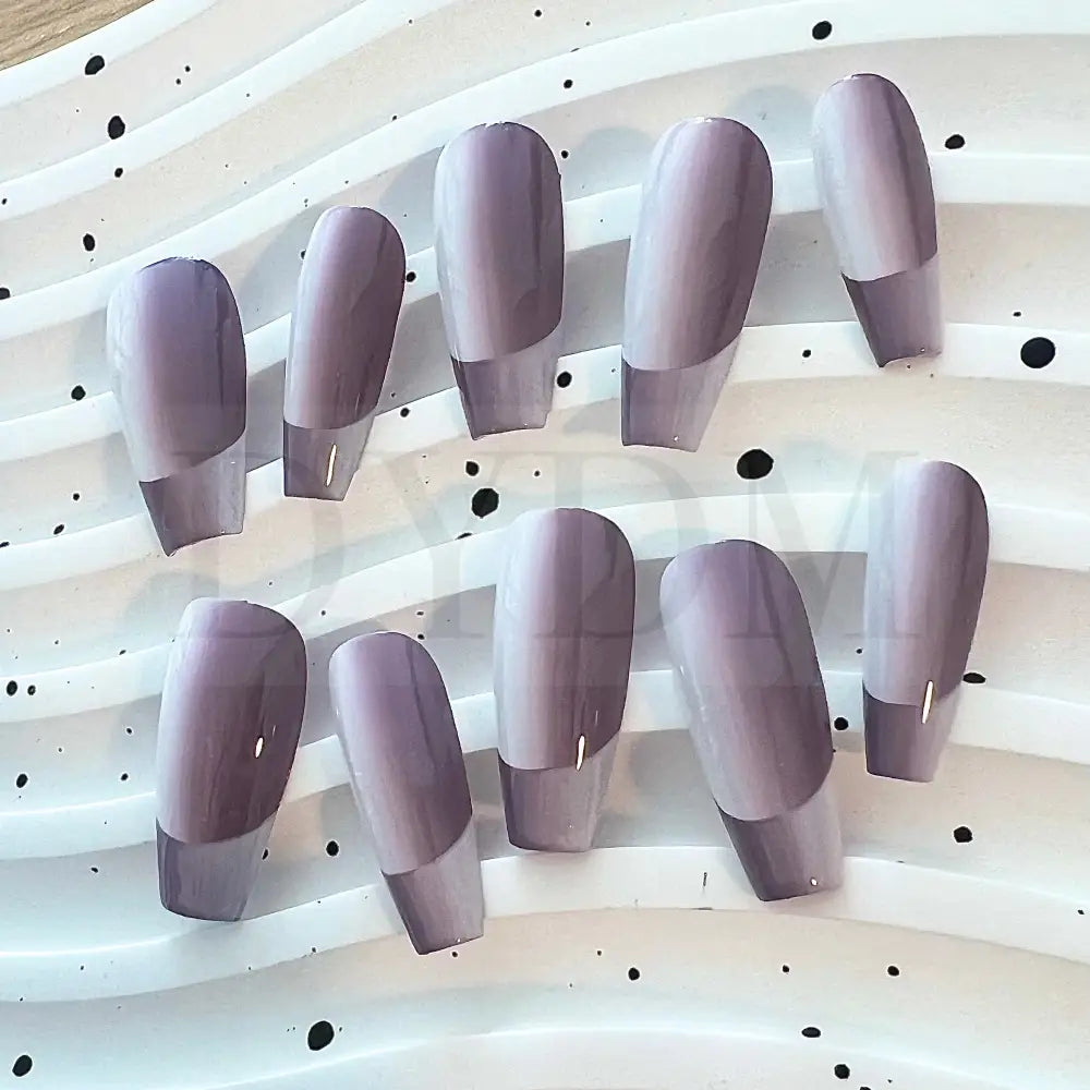 French Ombre Featuring a captivating purple gradient effect, these hand painted press-on manicure add a unique touch of style to your fingertip.